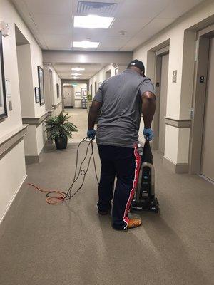 Enclave Cedar Park vacuuming hallway