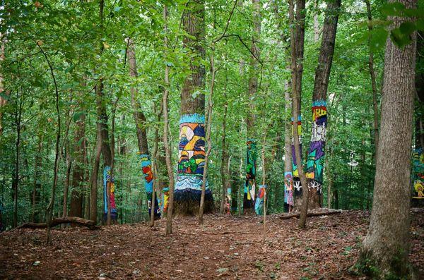 painted trees on red trail