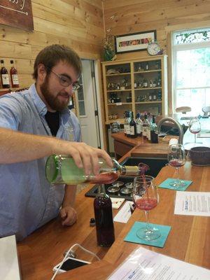 Justin pours our first glass of Rudy type wine...