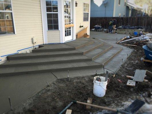 A freshly finished back patio in Fort Collins, CO. We poured very narrow steps to accommodate the owner's specific needs.