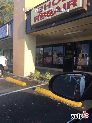 She works what looks like a hair salon/ barber shop. She has her own booth. She takes credit cards as well.