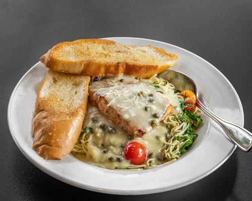 Angel hair pasta tossed in our piccata sauce with kale greens and cherry tomatoes.  Served with grilled salmon and garlic bread.