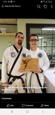 Mr Gray getting his black belt plaque