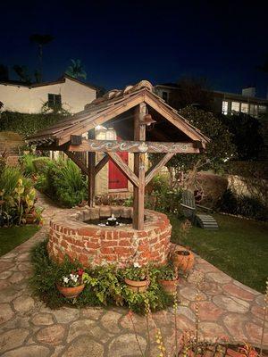 Wishing well at night.