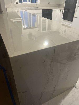 We had quartz installed from Italy with a beautiful waterfall.