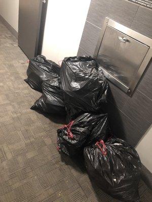 One of the many times trash piled up and made the entire hallway smell. Happens at least once a week.