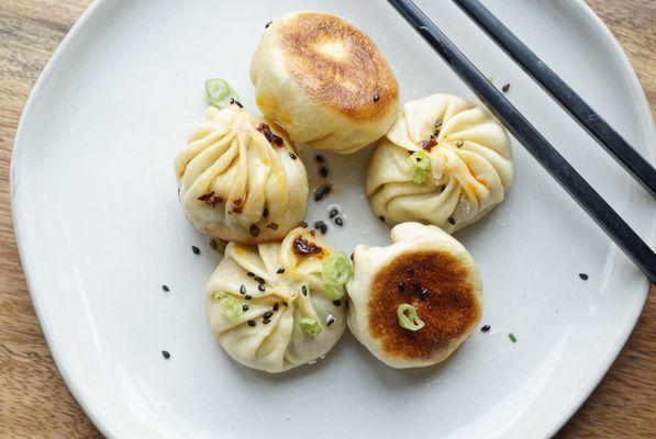 Shengjian Bao is a traditional soup dumpling that's crispy on the bottom with a flaky steamed bun on top.