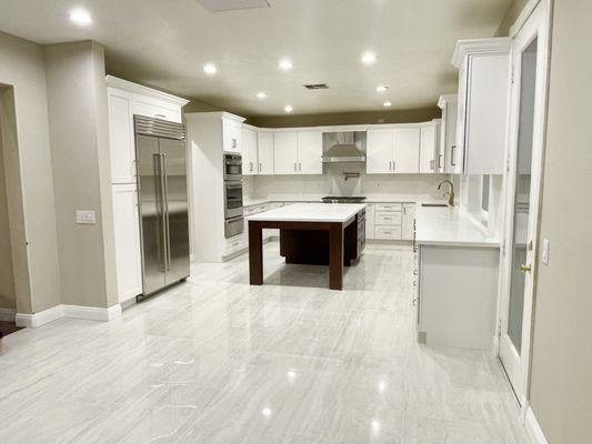 Kitchen remodel with large format tiles.