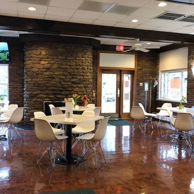 Rustic and modern. Great stone and unique wood floors that stand out against the clean crisp mid century modern vibe.