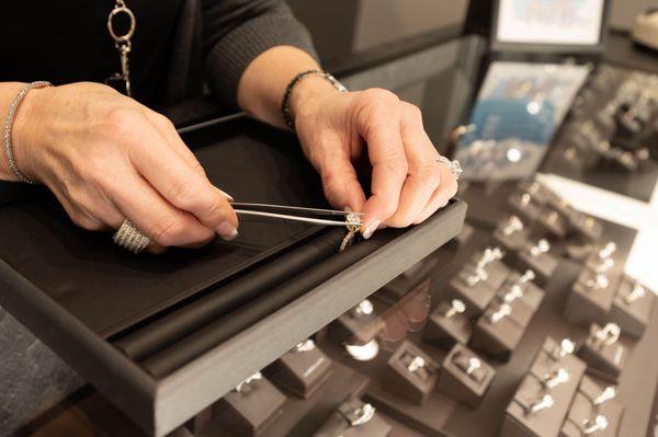 showing an engagement ring to a customer