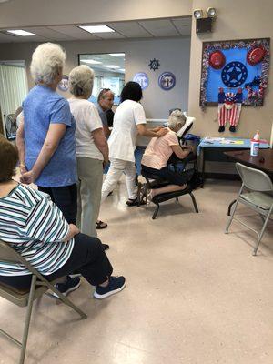 Hand massage at Copiague senior center by Axzons Home Health Care