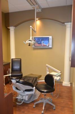 Treatment area is comfortable and equipped with TVs for enjoyment.