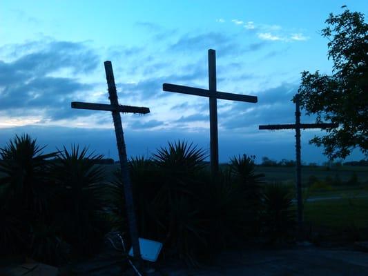 Three crosses at sunset in the grotto.