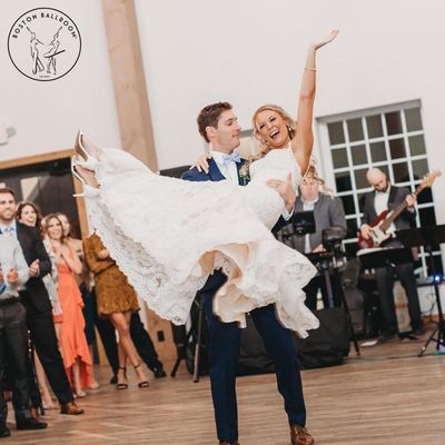 Couple does a Wedding Dance Lift during their first dance taking wedding dance lessons at Boston Ballroom.