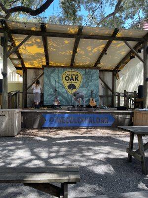 Stage and musicians doing sound checks.