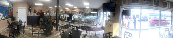 Panoramic photography displaying retail floor and dine in area.