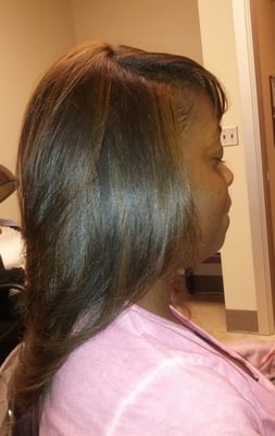 Natural hair straighten with highlights added.