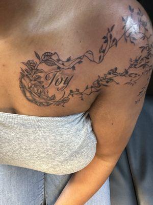 Her daughter name with rose n poison ivy going down her shoulder narm