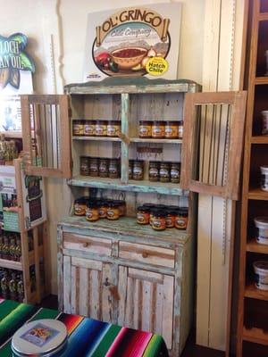 Salsas in a vintage cupboard