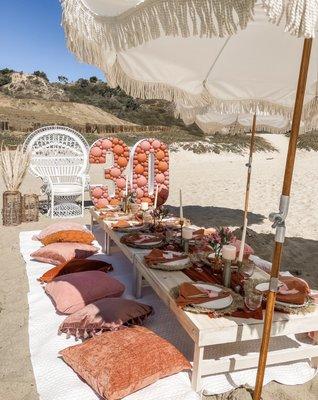 Boho picnic set up at Will Rogers State Beach.