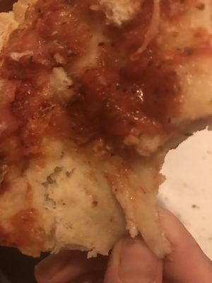 You can see my finger pulling the raw dough on this "pizza". Don't mind me I know I need a manicure.