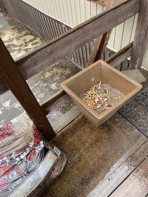 The cigarettes tie into my review. Many cigarette butts right outside the door.