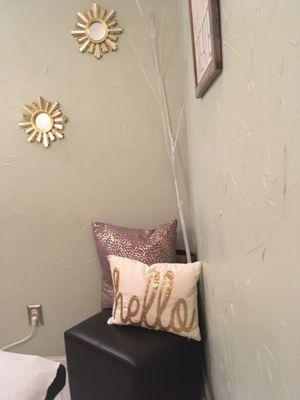 I love the pillow decor...it makes the small room feel comfortable