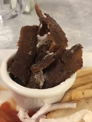 Gyro jerky.  This is the almost inedible portion of gyro meat served.