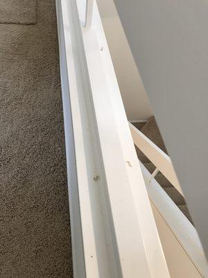 random carpet fiber left on the stair railing