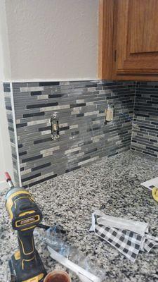 Installation of backsplash and kitchen painting after Fire damage.