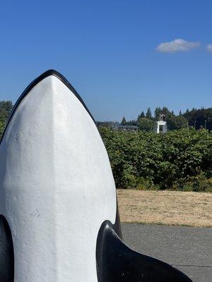 Sculpture from the park with a view of the Peace Arch at the border