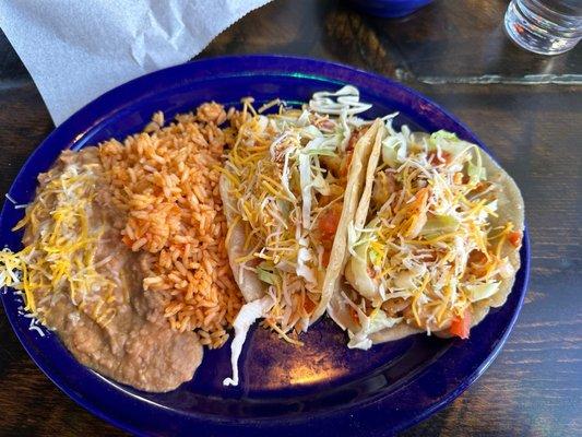 Shrimp Tacos with beans, and rice...chips and salsa were complimentary! Margs are tasty and large!