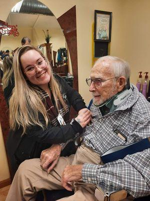 Isabella taking 
 Dr. Hartness to the Barber Shop!!