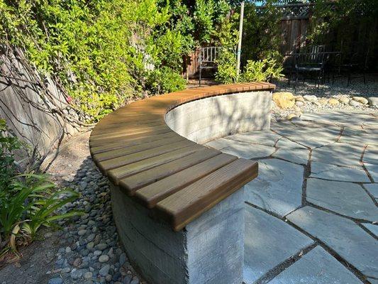 Custom made timber seat over the concrete bench