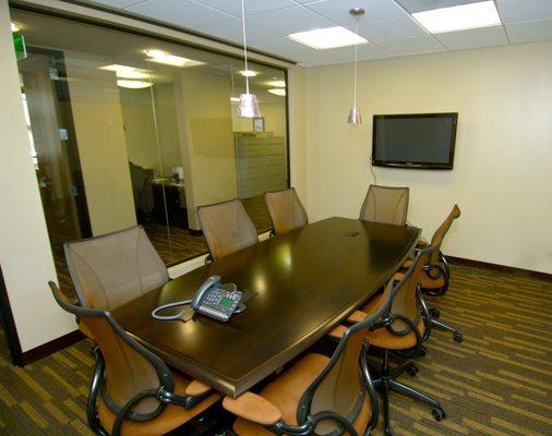 Conference table where our immigration services team has helped numerous people obtain work visas and green cards.