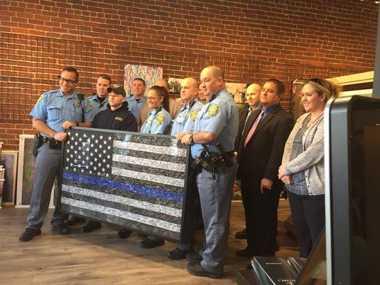 Sedgwick County Sheriffs with Blue Line flag framed by L'image and signed by the Wichita Community in memory of Deputy Robert Kunze.