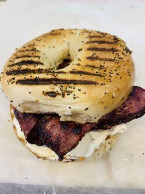 Bacon with cream cheese on a toasted bagel