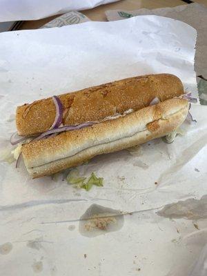 A tuna sub with hardly any tuna inside