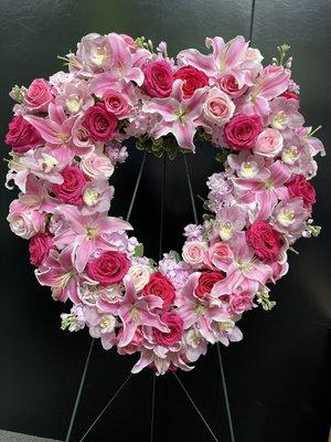 Honoring life, with this open heart of shades of pink flowers