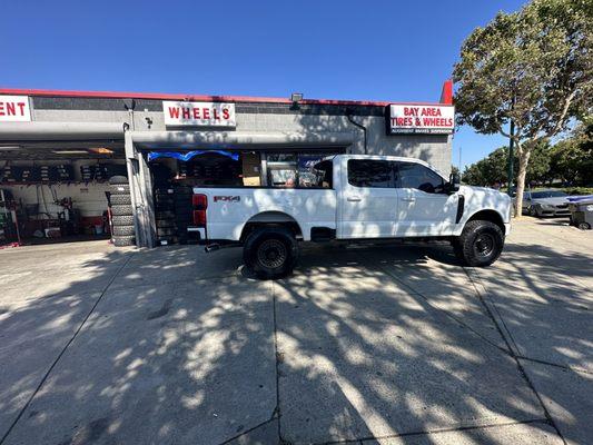 They put on a leveling kit 2.5 inches on the front and 37s on some Rhinos 17s. They did a really good job and great prices!