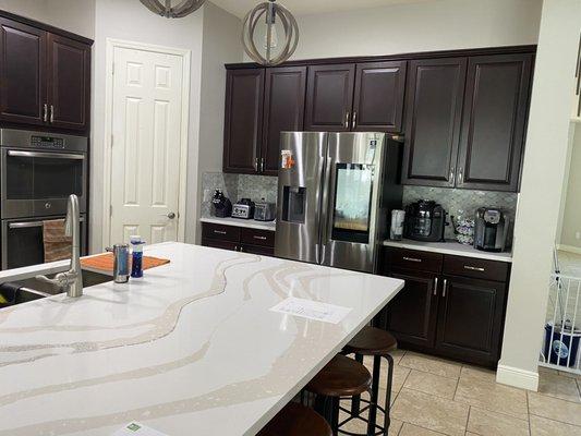 Refreshed tired kitchen with new quartz and marble backsplash