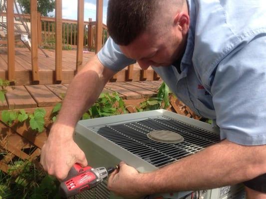 Senior technician repairing air conditioning