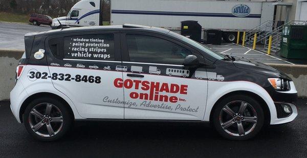 Satin White Paint Wrap, Reflective Red, Reflective White, Black and Gray Lettering, Cutout Graphics and Pinstripe, Pinnacle window film