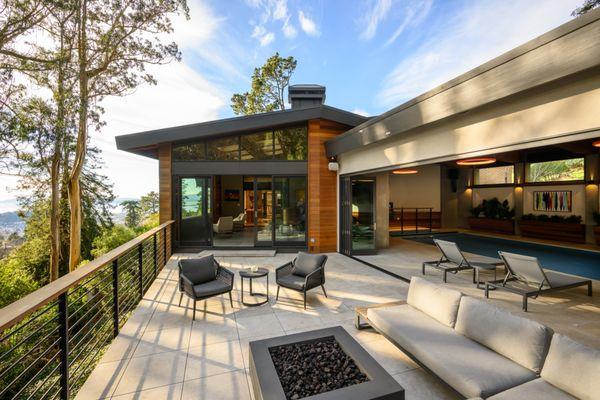 Sun Room addition, deck remodel, and interior pool renovation at a Midcentury Modern home in Kensington, CA