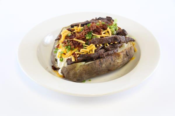 Steak filled Baked Potato topped with all the fixings. Office Favorite!