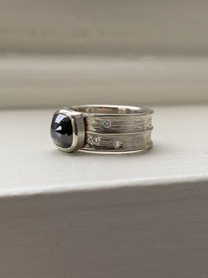 Custom Black diamond engagement ring set in 14k white gold. Fine, handmade wedding jewelry.