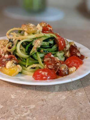 Roasted rainbow tomatoes and feta cheese with Zucchini "noodles".