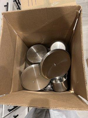 All Clad pots and pans just thrown in a box, no wrapping, bubble wrap or protection!!!!