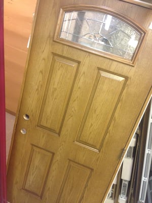 20 gauge door with wood grain stamped into steel. was stained to match customers door