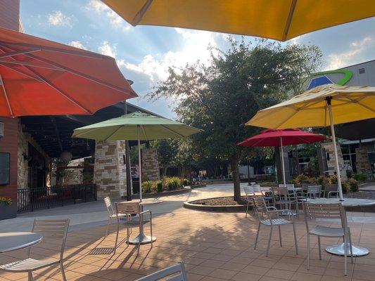 Additional sit down areas with the umbrellas and tables